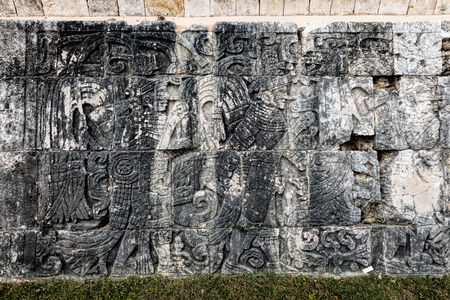 Ancient Mayan mural at the Great Ball Court in Chichen Itza depicting the ball players wearing...