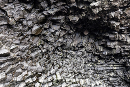 Black rock formations on the ceiling of the Halsanefshellir cave on the Reynisfjoru beach, near the village of Vik in southern Iceland.の写真素材