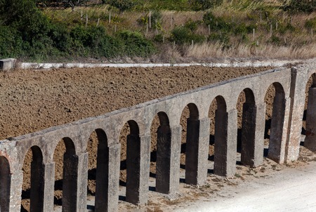 16th century aqueduct outside the walls of Obidos, Portugal, built by Queen Catherine of Austria, wife of King John III (1521-1557) to provide water to the town's main fountains.の写真素材