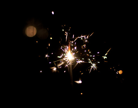 Sparklers on a black background. Shallow depth of field