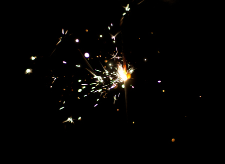 Sparklers on a black background. Shallow depth of field