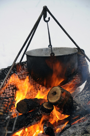Pot of soup on the fire.の写真素材