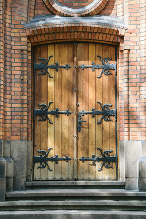 entrance wooden metal door to the Christian Catholic Churchの写真素材