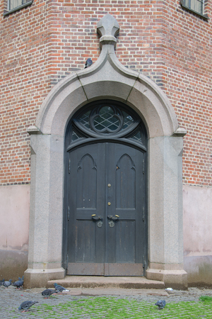 wooden entrance door to the old buildingの写真素材