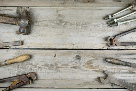 Old wooden desktop. Old rusty carpentry tools. Horizontal mockupの写真素材