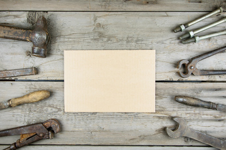 Old wooden desktop. Old rusty carpentry tools. Horizontal mockupの写真素材