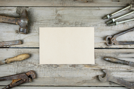 Old wooden desktop. Old rusty carpentry tools. Horizontal mockupの写真素材