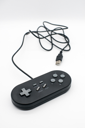 retro black joystick isolated on white backgroundの写真素材