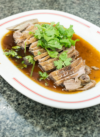 Steamed duck / goose served with coriander on top.  Thai cusine.の写真素材