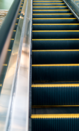 Escalator in shopping mall. Moving up staircase. escalator. electric escalator.Close up to...