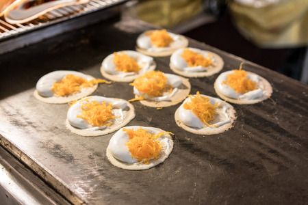 Thai Traditional Snack and Dessert. Thai Crispy Crepes Filled with Coconut Cream.の写真素材