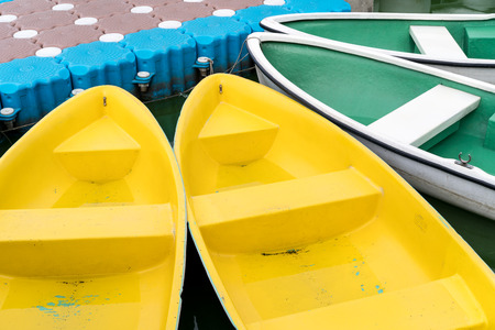 Colorful rowboats for rental in a lakeの写真素材