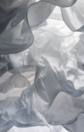 Close up decorative lamp for abstract background. Wavy paper structure with light and shadow. White complexity concept.の写真素材