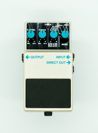 Vintage guitar pedal isolated on white background