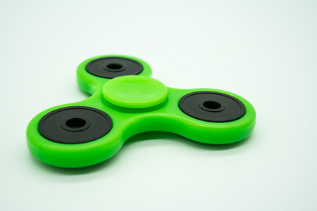 Green fidget spinner isolated on white background.の写真素材