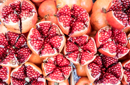 Cut and Seeds of ripe pomegranate for juice promotion in Thailand fruit market.の写真素材