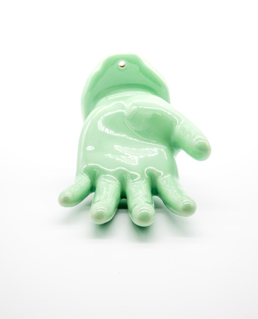 Hand figure made of jade for home decoration isolated on white backgroundの写真素材