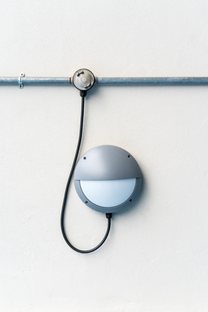 Pathway or wall light for modern design building or house againt white concrete wallの写真素材