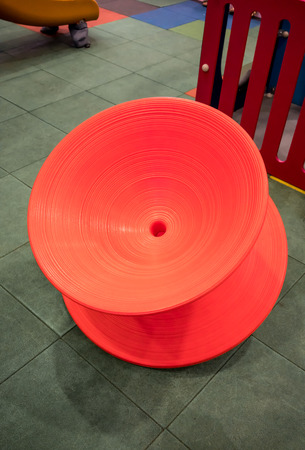 Colorful spinning seat chair for kid in playgroundの写真素材