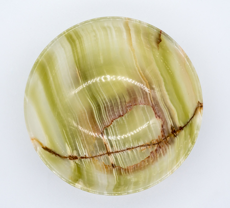 Jade bowl with abstract stripe pattern isolated on white background.の写真素材