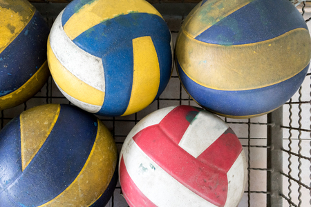 Group of used and dirty volley balls in storage.の写真素材