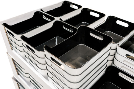 Stack of black plastic trays arrangement for background. Multi-purpose kitchenware collection