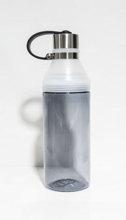 Grey transparent sport bottle for drinking isolated on white backgroundの写真素材