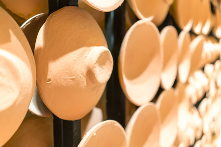 Rows of traditional clay pot lids for pattern and background.の写真素材