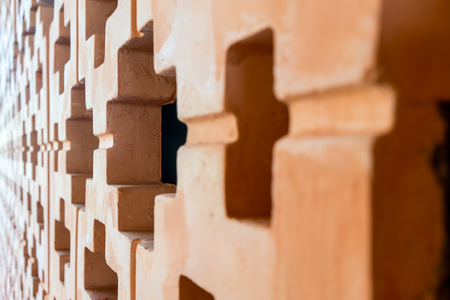 Orange brick wall pattern in perspective view with depth of fieldの写真素材