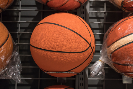 Basketballs on the rack of sports retail store ready for saleの写真素材