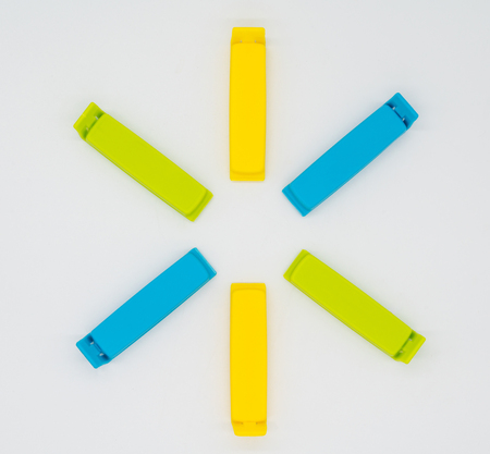 Various colorful bag clips isolated on the white background.の写真素材