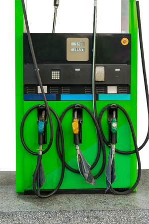 Three colors of fuel nozzle at gas station isolated on white backgroundの写真素材