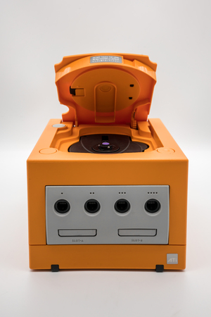 Bangkok, Thailand - March 7, 2018: Nintendo Gamecube Console in orange color, Vintage portable game by Nintendo. Illustrative, editorial.のeditorial素材