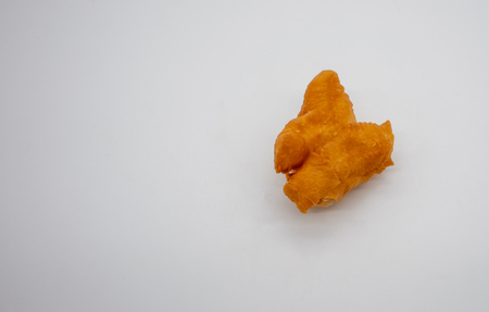 Pa Thong Ko, pair of connected dough  fried sticks, on white background with copy space. Famous breakfast in Thailand.の写真素材