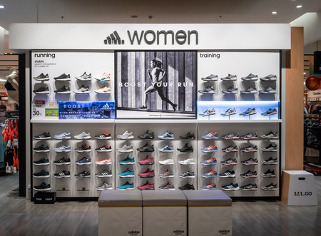 Nike shop at Central Rama9, Bangkok, Thailand, April 30, 2018 : Trendy and fashionable brand of sportswear showroom with modern interior shop design.のeditorial素材
