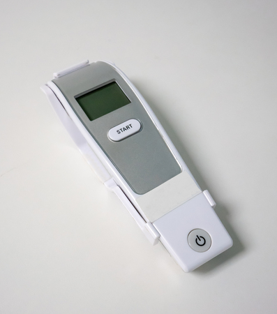 Digital fever thermometer isolated on white backgroundの写真素材