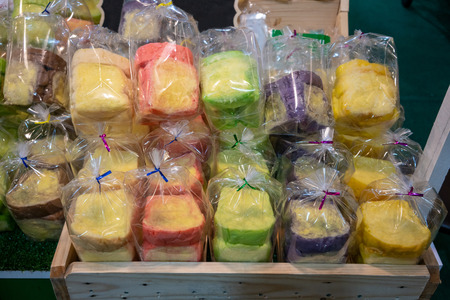 Colorful bread with butter and sugar on top in clear plastic packaging ready for sale