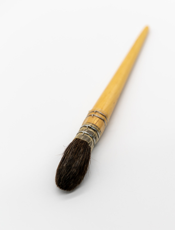 Paint brush isolated on white background. Wooden tool for artist.の写真素材