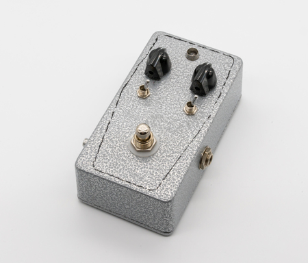 Silver texture vintage guitar pedal isolated on white backgroundの写真素材