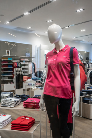 Lacoste shop at Central Rama 9, Bangkok, Thailand, Apr 30, 2018 : Fashionable clothing and sportswear brand. Store interior and product display.のeditorial素材