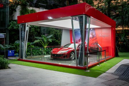 Ferrari Showroom at Emquatier, Bangkok, Thailand, July 20, 2018 : Luxury car temporary outdoor showroom window display in department storeのeditorial素材