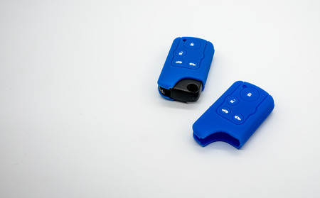 Car key and blue silicone isolated on white background with copy spaceの写真素材