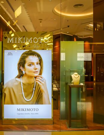 Mikimoto shop at Siam Paragon, Bangkok, Thailand, May 9, 2018 : Luxury pearl necklaces and jewelry brand window display at the store.のeditorial素材