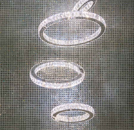 Crystal rings LED chandelier pendant light hanging from ceiling for interior decoration.