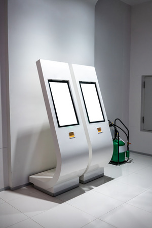 Touch blank screen with modern curve stand against white background. Modern interactive kioskの写真素材