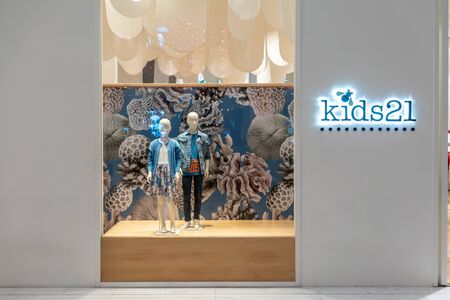 Kids 21 shop at Emquatier, Bangkok, Thailand, Feb 3, 2019 : Luxury and fashionable kids clothing brand window display against sea and ocean background.のeditorial素材