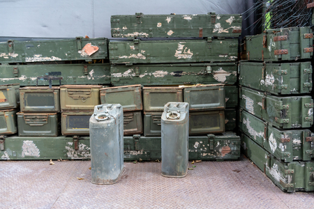 Stack of green and old rusty ammunition box. Military green ammunition boxes.の写真素材
