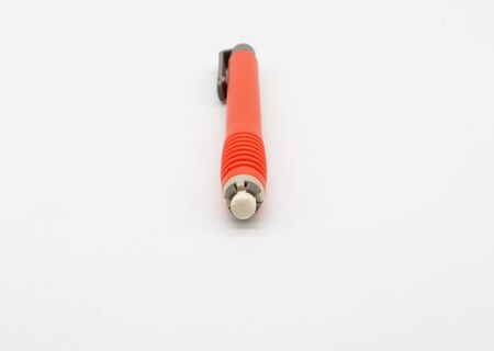 Pen shaped white eraser in red color isolated on white background.の写真素材