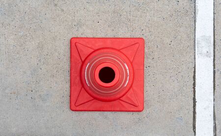 Top view traffic cone on concrete road.