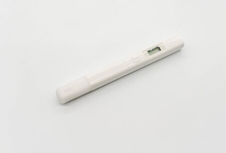White digital water TDS tester isolated on white bakground.